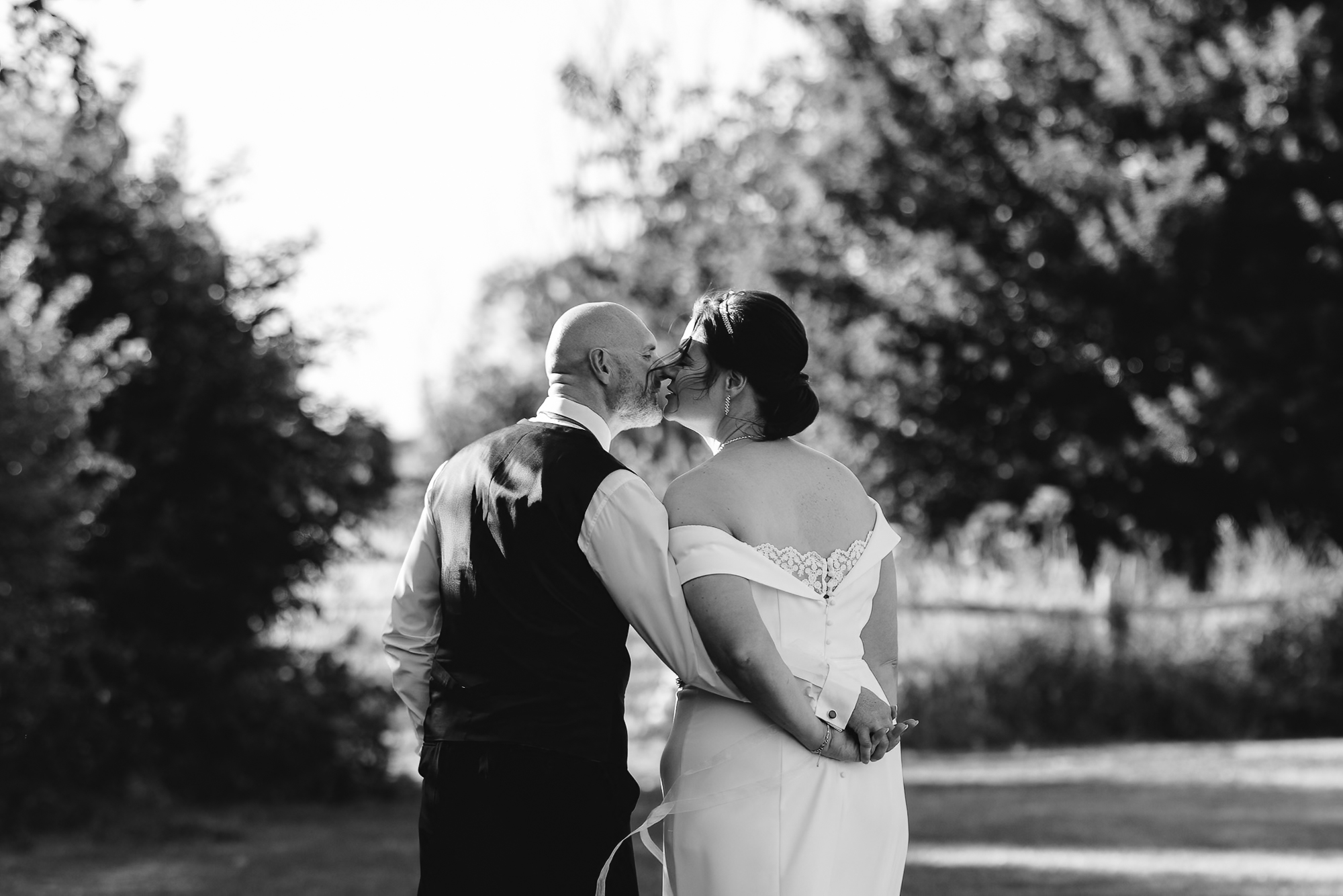 Bride and groom walking outdoors at a Leeds wedding venue