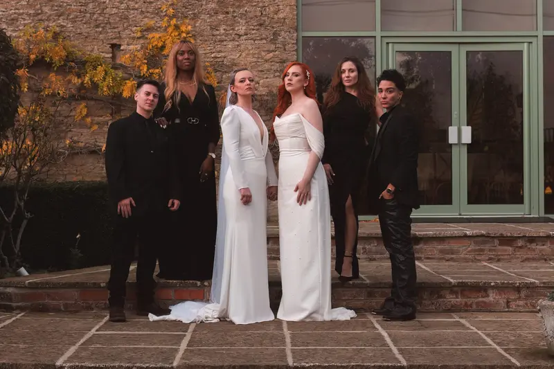 Stylish lesbian wedding group portrait with cinematic editorial photography in Yorkshire