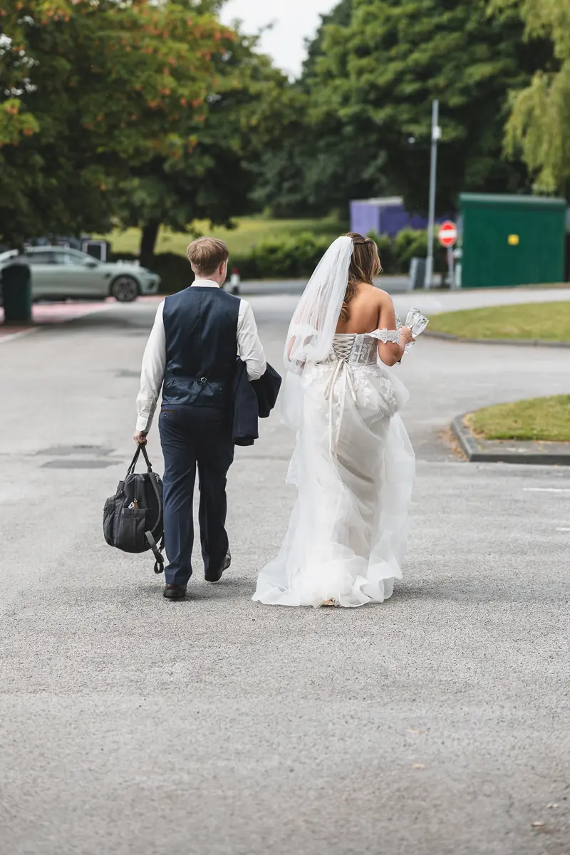 Bride and groom walking away together after their wedding ceremony