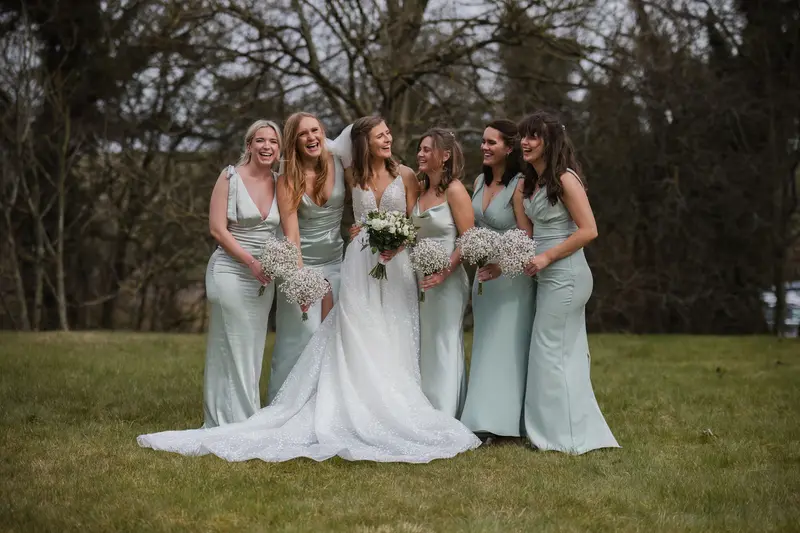 Relaxed bridesmaids and bride portrait outdoors at Yorkshire documentary wedding