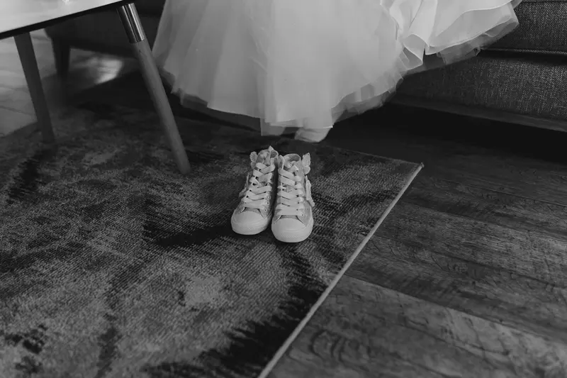 Black and white flower girl shoes detail photo at Yorkshire documentary wedding