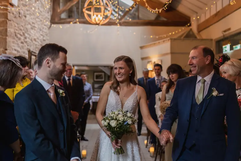 Emotional bride entrance during intimate Yorkshire barn wedding ceremony