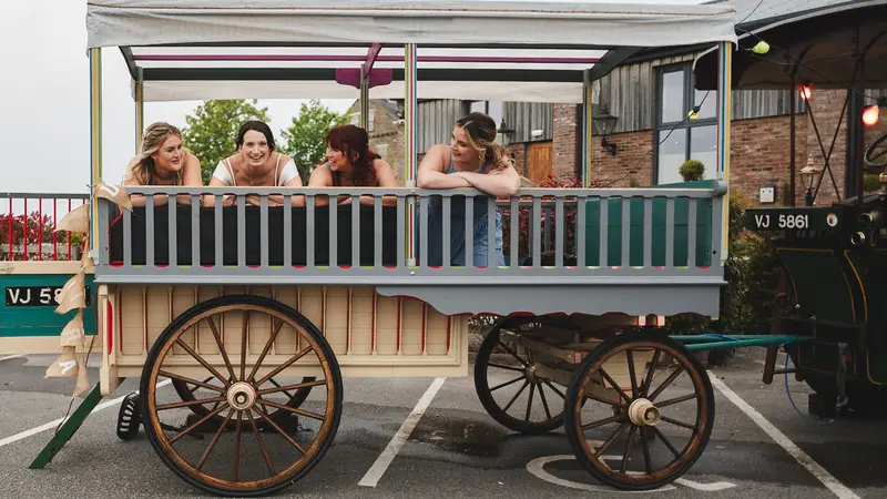 Bridesmaids enjoying vintage wedding carriage ride at Yorkshire wedding venue