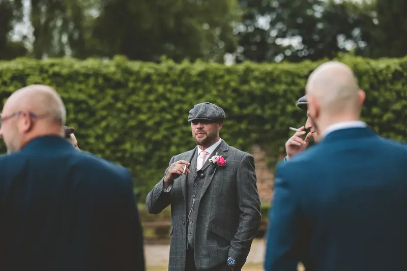Groom waiting outdoors before the wedding ceremony in natural documentary style