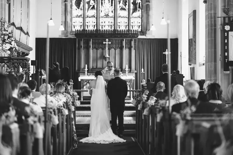 Black and white documentary church wedding ceremony photo