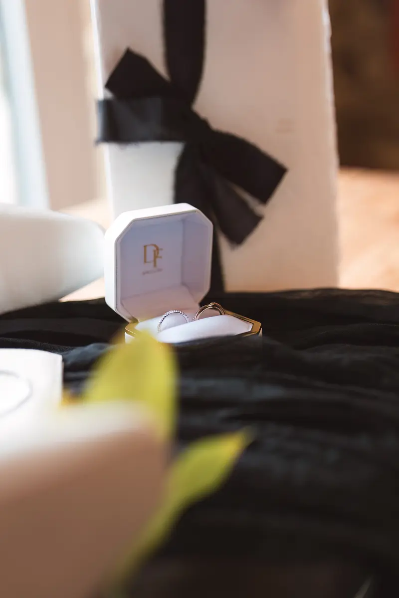 Wedding rings and bridal details flat lay photography