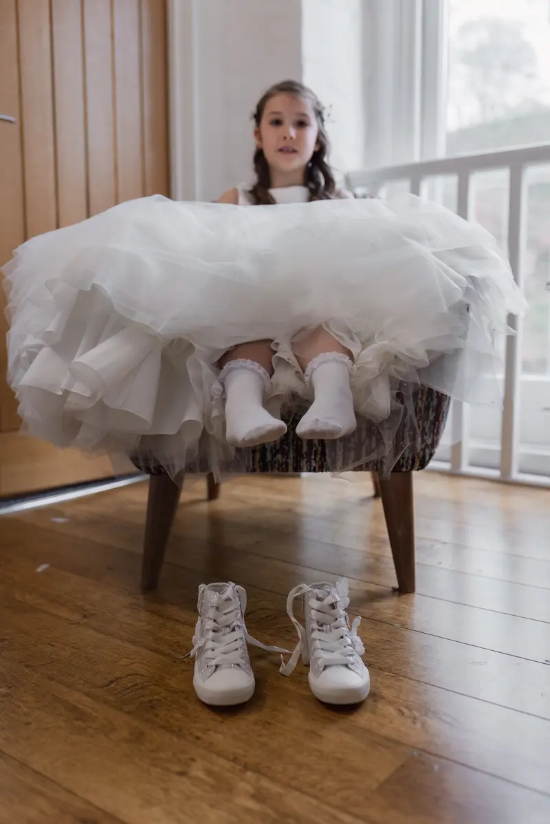Candid flower girl portrait during bridal preparations at Yorkshire wedding venue