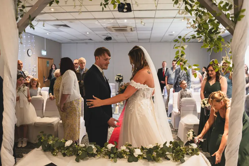 Bride and groom exchanging vows during their intimate wedding ceremony