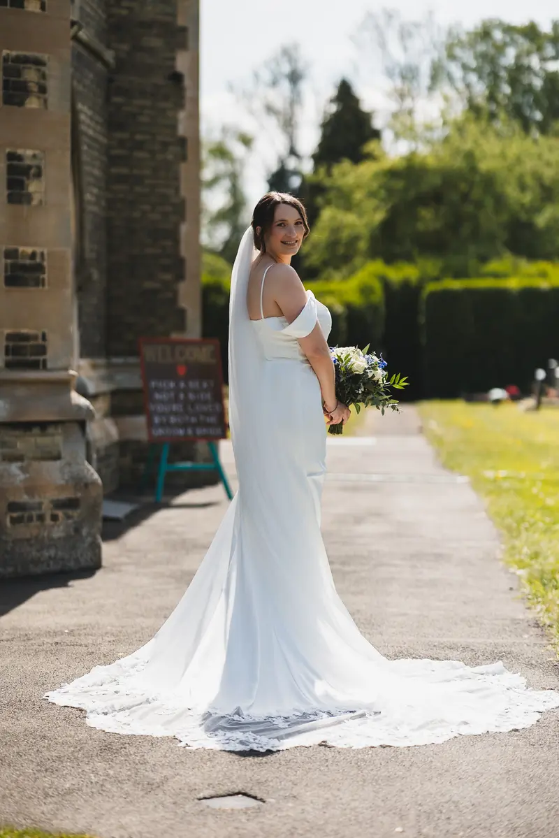 Elegant bridal portrait outside countryside church venue