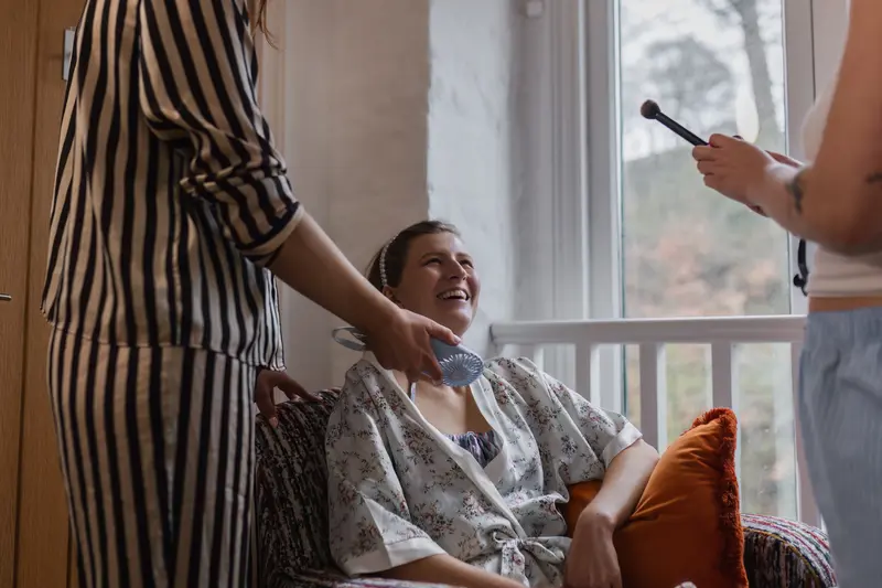 Candid bridal morning laughter during wedding preparations in Yorkshire wedding venue