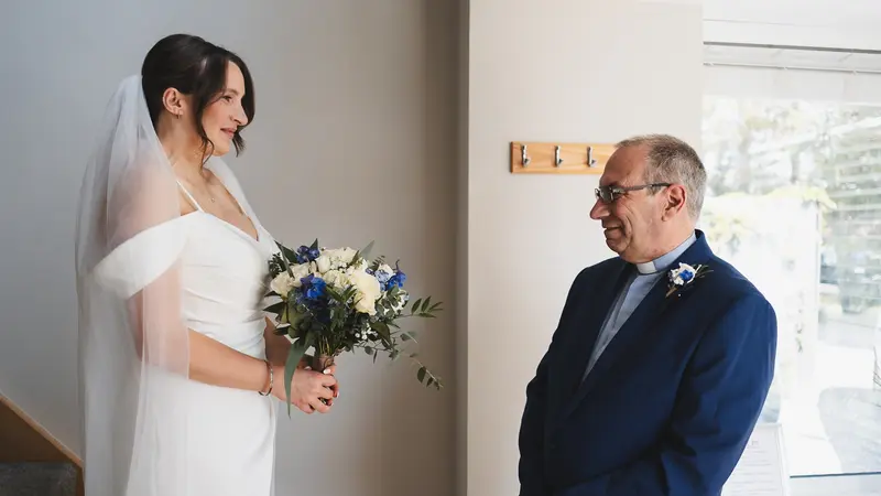 Emotional father and bride first look before wedding ceremony