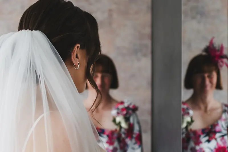 Emotional bridal moment during wedding morning preparations