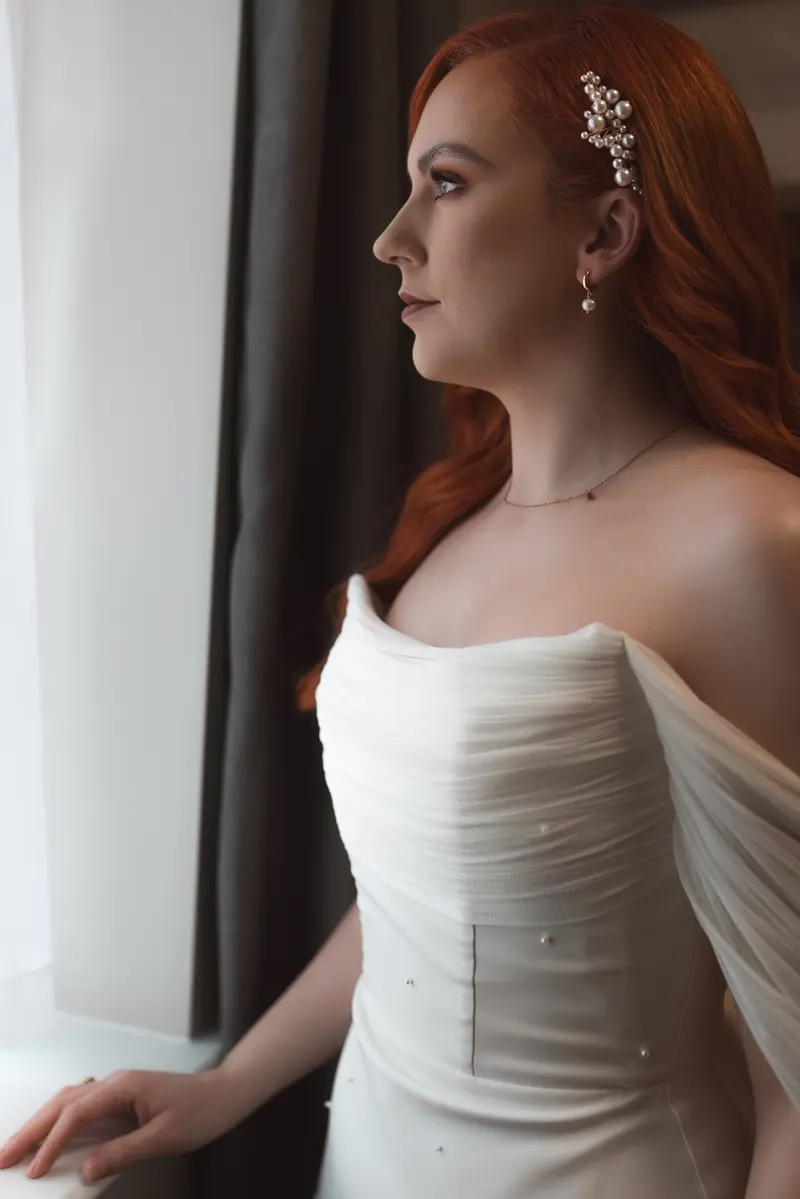 Bridal portrait by window with soft natural light wedding photography