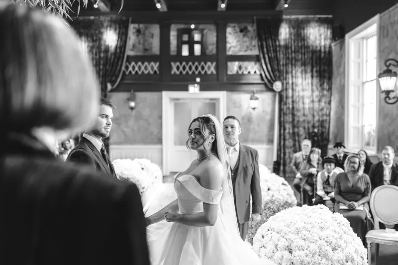 Documentary black and white bridal portrait during wedding ceremony