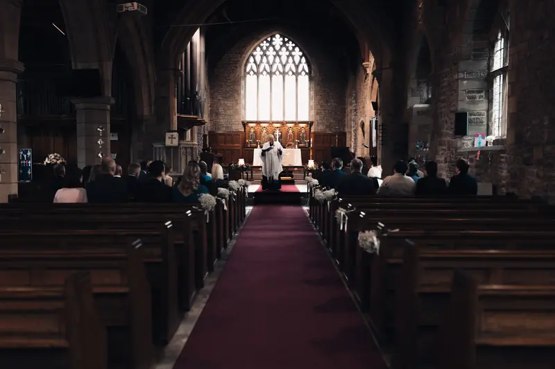 Wide cinematic church ceremony photograph at Yorkshire wedding venue