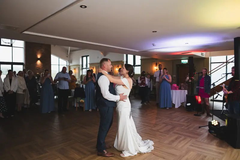 Romantic first dance wedding photography with live music and emotional moments