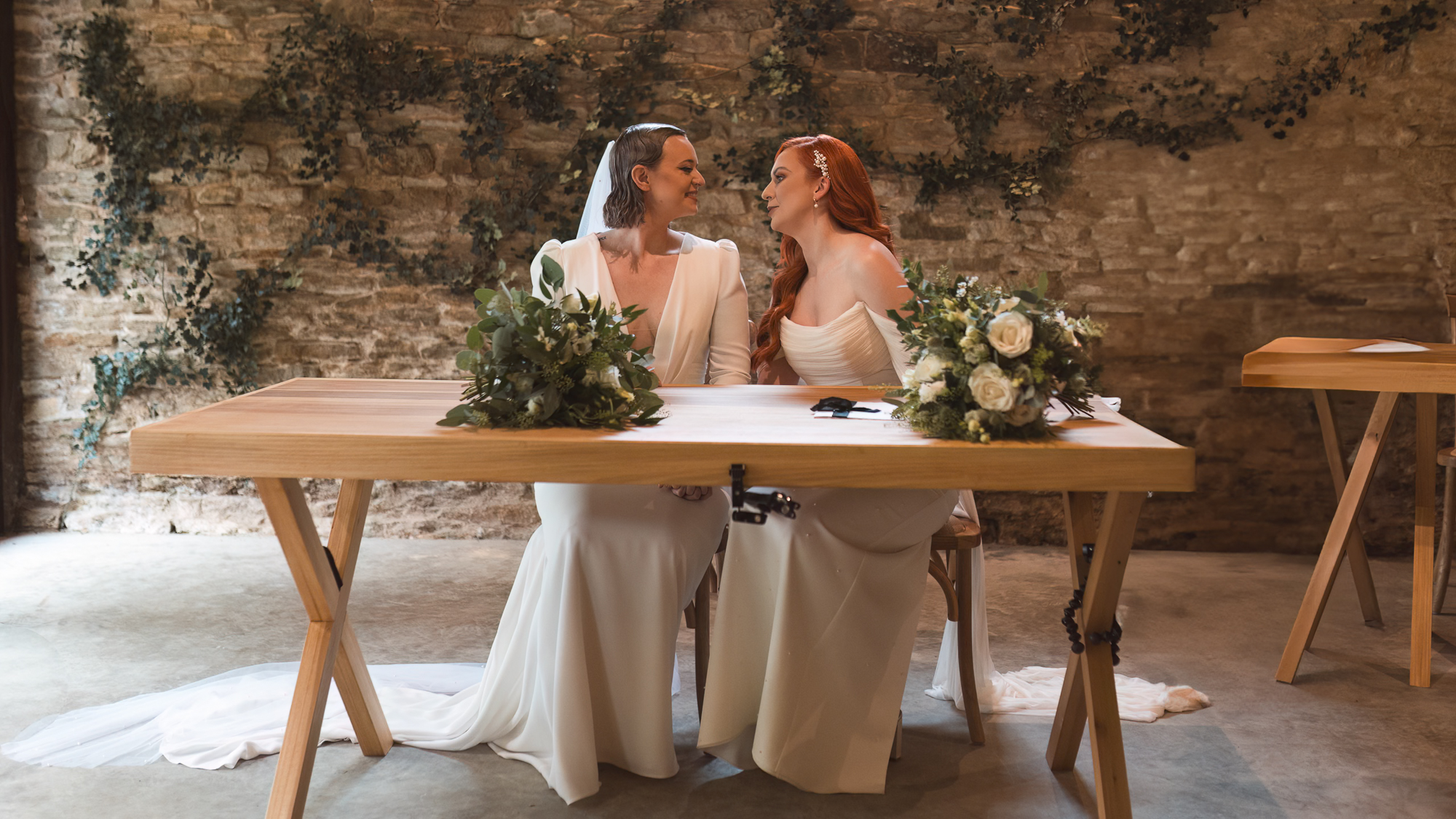 Lesbian wedding couple portrait during intimate ceremony signing