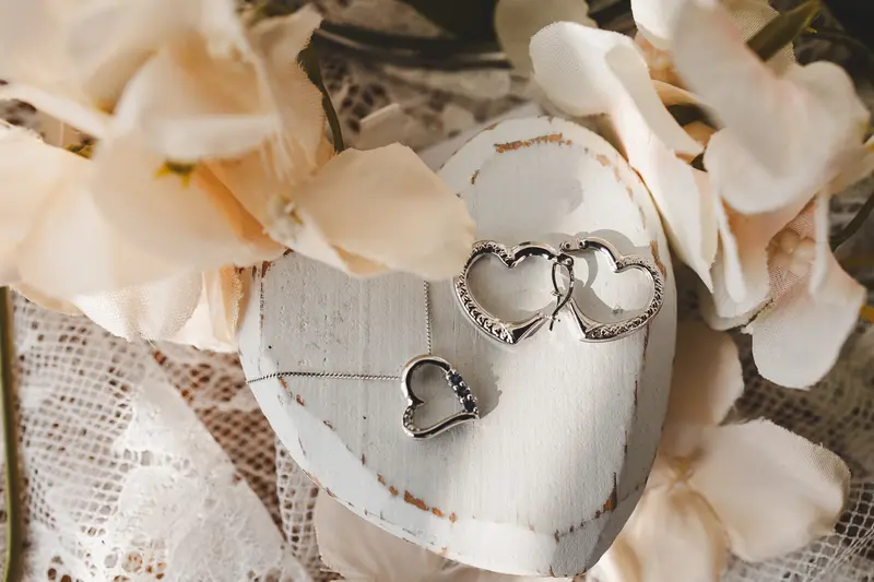 Wedding rings and bridal necklace detail shot at The Manor Rooms
