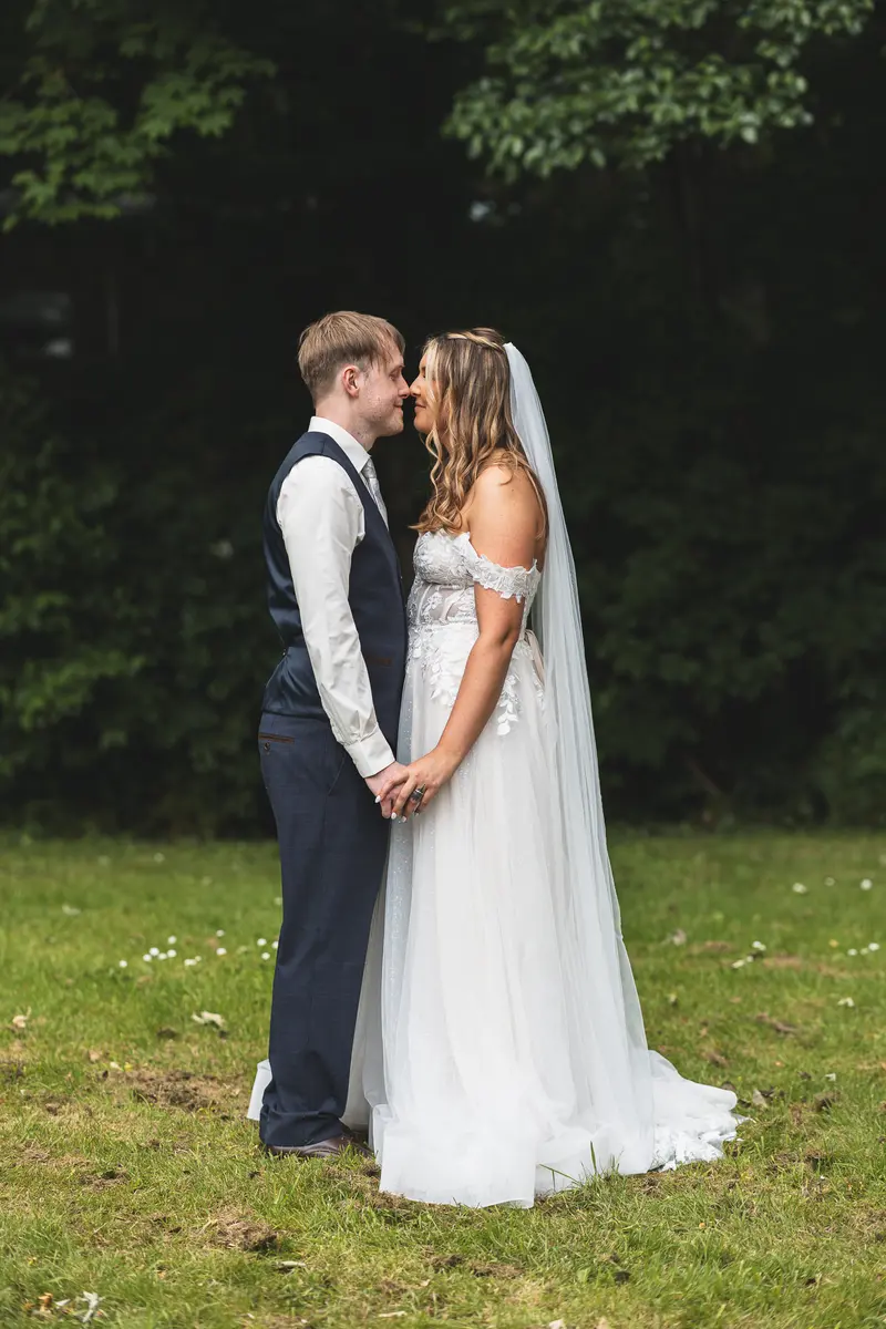Romantic full length portrait of newlyweds during golden hour wedding photography