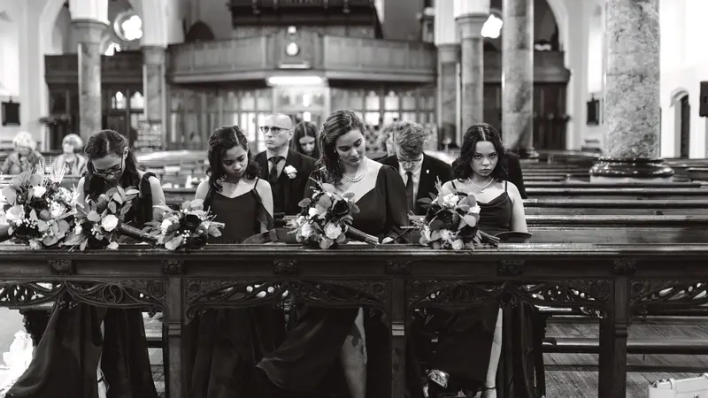 Black and white documentary bridesmaids portrait captured at Yorkshire church wedding