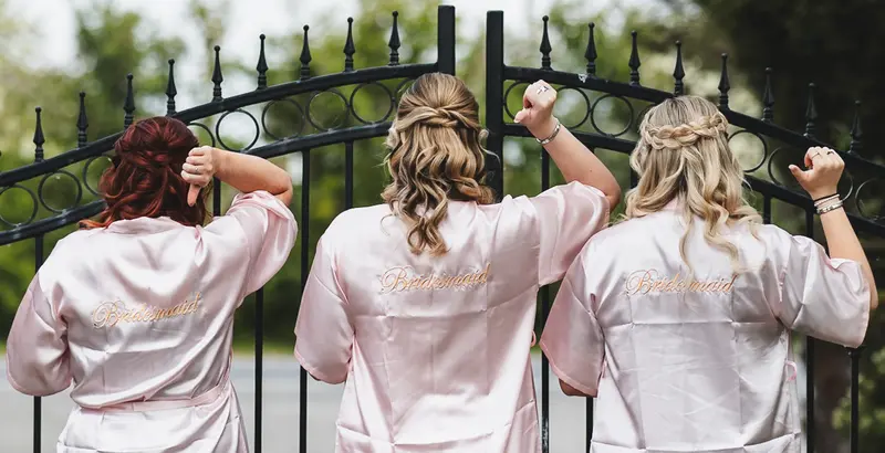 Bridesmaids getting ready robes photo with candid wedding moments