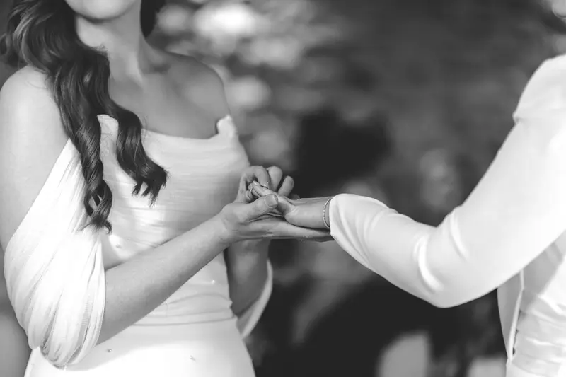 Emotional wedding ring exchange during intimate LGBTQ ceremony in Yorkshire
