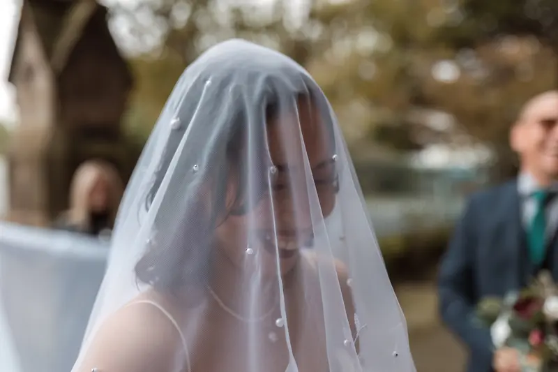 Emotional documentary bridal portrait in Yorkshire with cinematic wedding veil photography