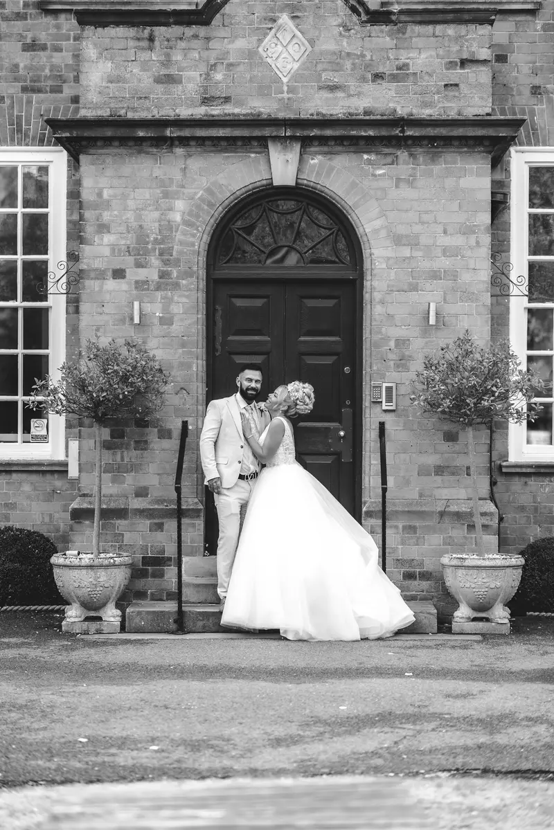 Black and white wedding couple portrait at historic venue, timeless documentary wedding photography