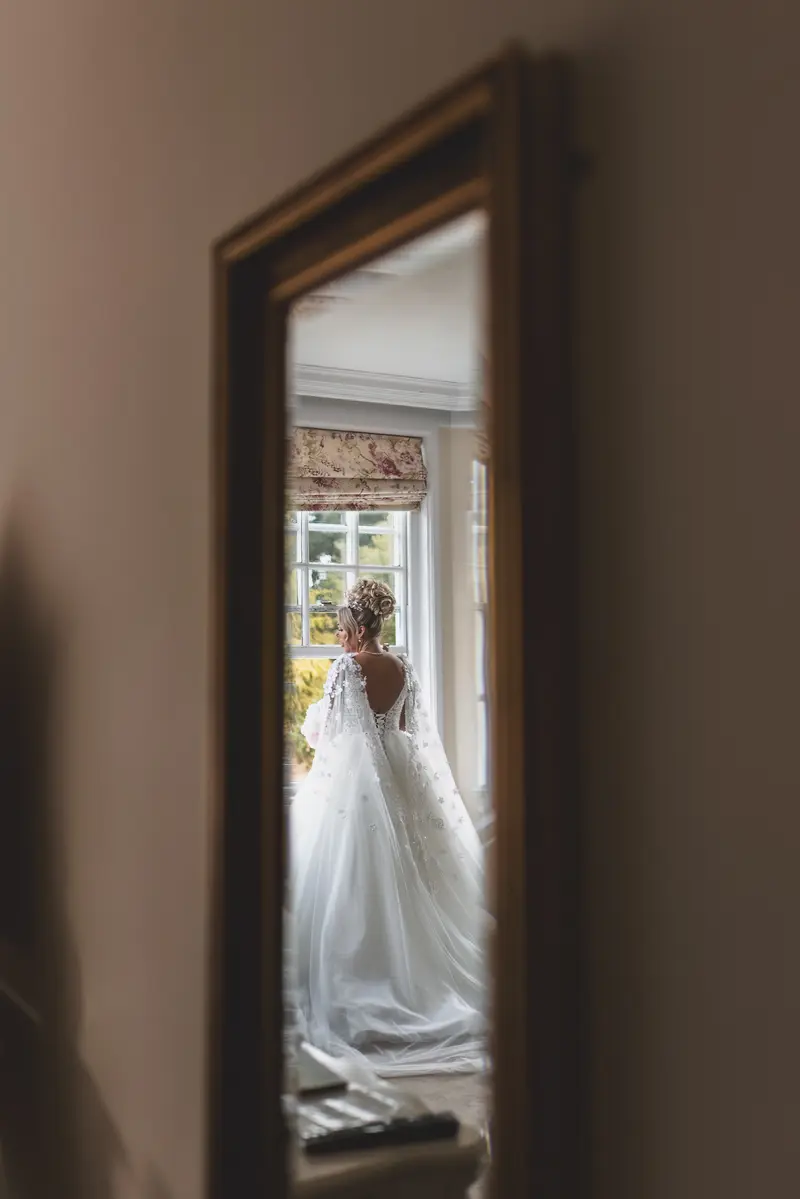 Reflection bridal portrait in mirror, elegant bride photography, cinematic wedding style