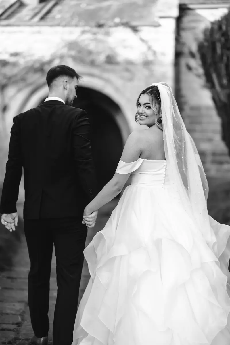 Bride and groom outside historic Yorkshire wedding venue in Leeds