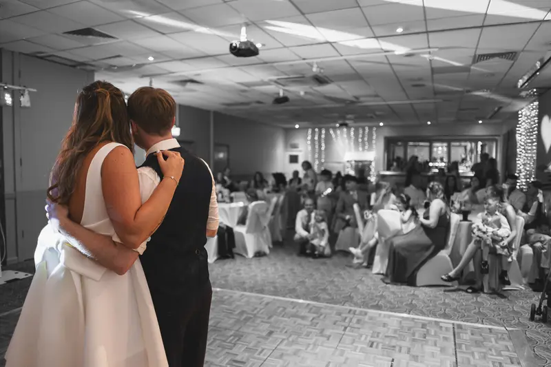 Black and white documentary wedding speech with emotional bride and groom