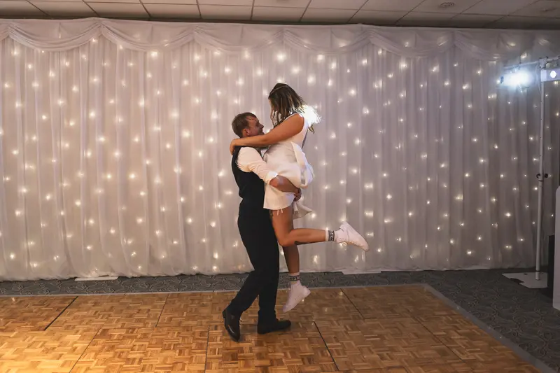 Bride and groom dancing together during their wedding reception