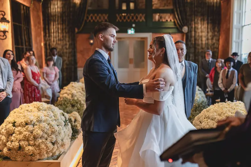 Romantic indoor wedding vows during elegant ceremony in Yorkshire