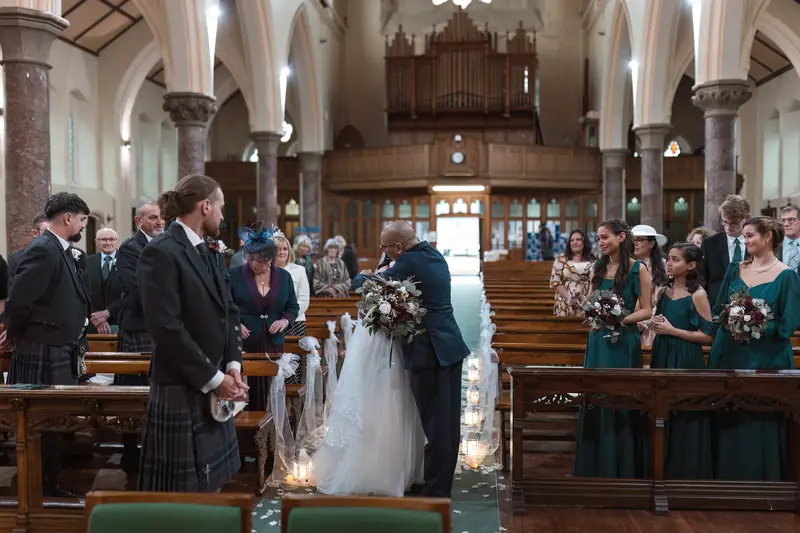 Authentic father and bride ceremony entrance photographed by Yorkshire documentary wedding photographer