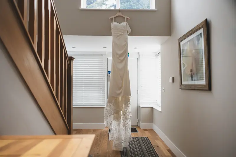 Bride wedding dress hanging before ceremony at Yorkshire wedding