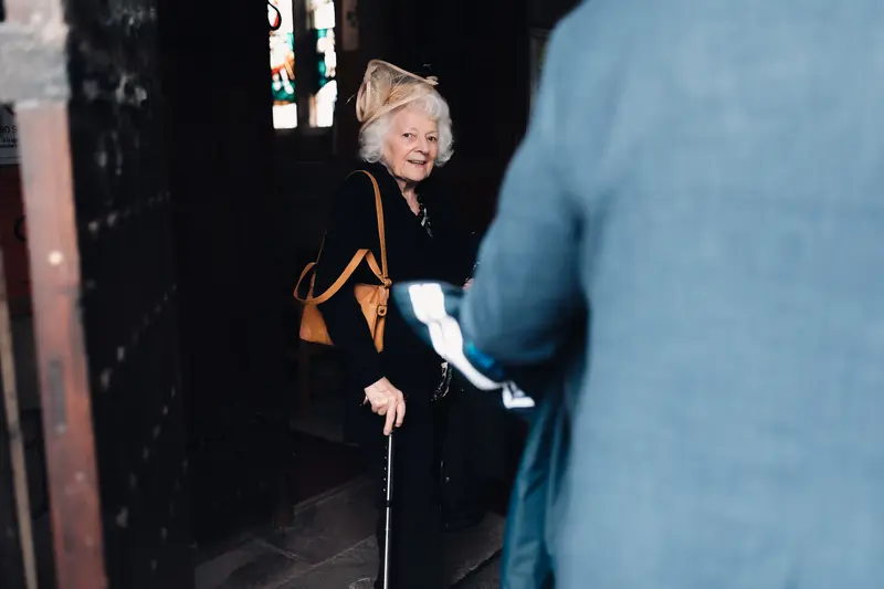 Candid documentary wedding photography Yorkshire capturing emotional guest arrival at church