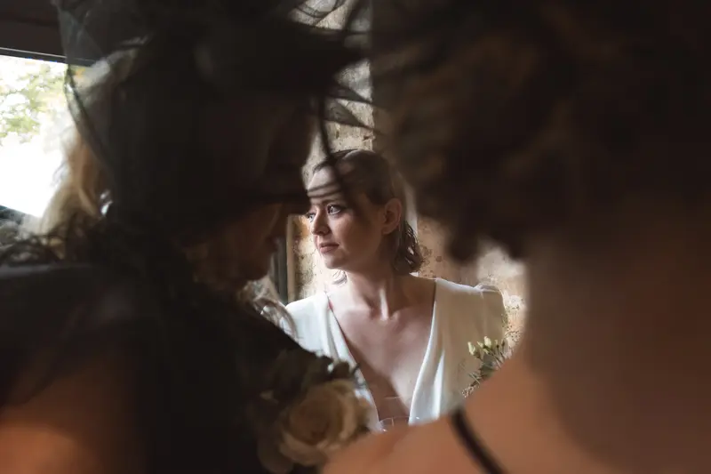 Candid bridal prep portrait rustic venue