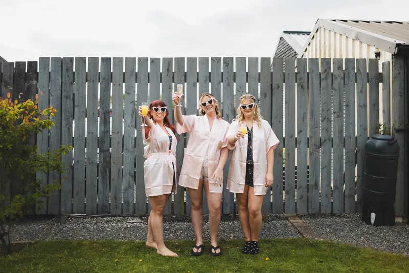 Bridesmaids celebrating during wedding morning preparations in Yorkshire