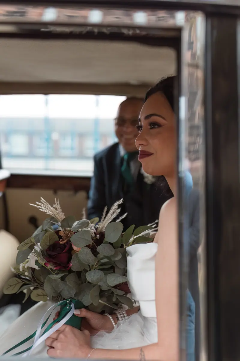 Candid documentary wedding photography Yorkshire bride portrait inside classic wedding car