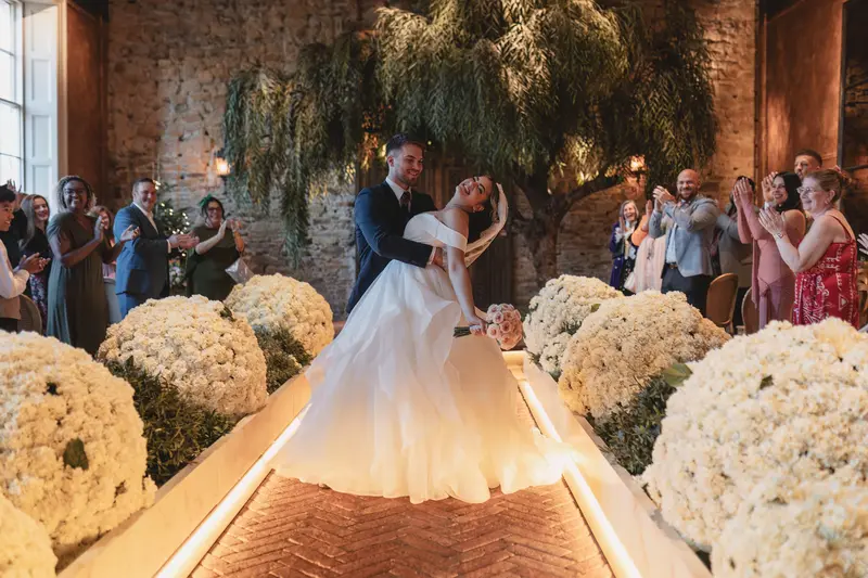 Joyful wedding ceremony celebration with guests applauding newlyweds