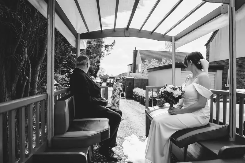 Black and white documentary wedding photo before church ceremony
