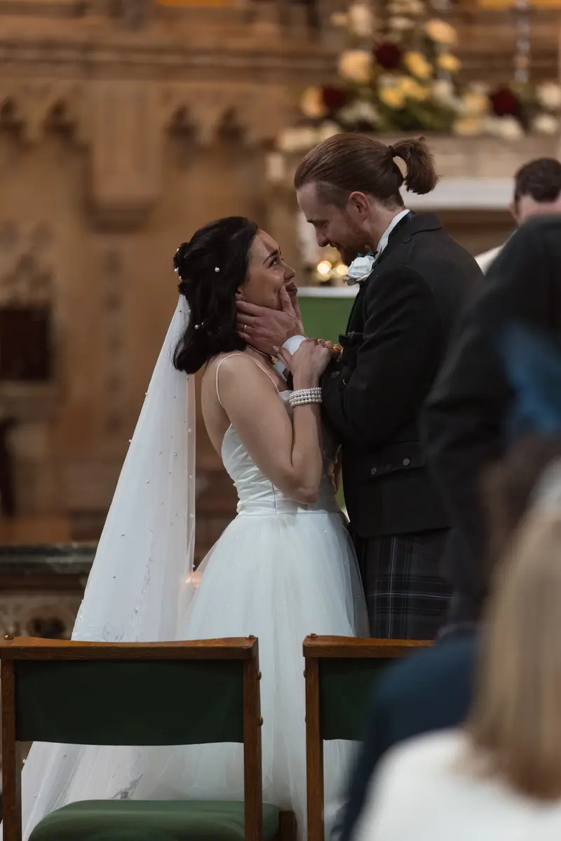 Romantic couple portrait during church wedding ceremony in Yorkshire, cinematic wedding photographer