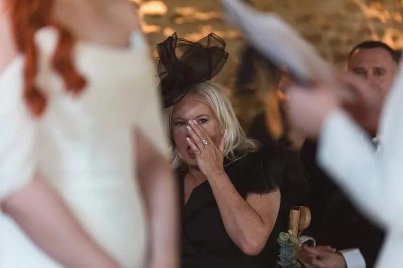 Emotional wedding guest crying during intimate LGBTQ ceremony in Yorkshire