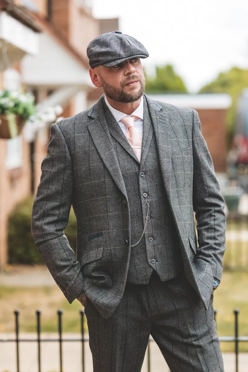 Groom walking outdoors before the ceremony during natural groom portraits