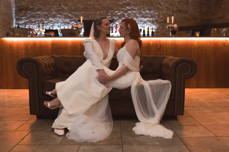 Moody wedding couple sofa portrait barn venue
