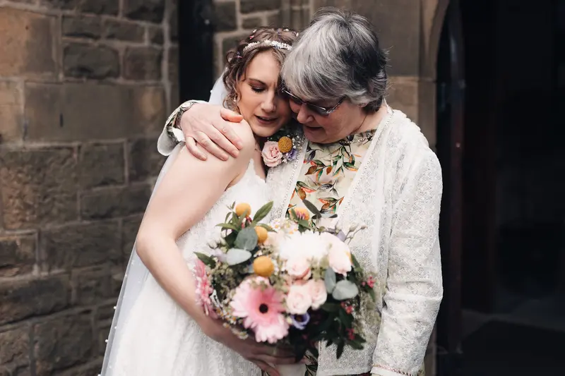 Emotional mother and bride hug captured by Yorkshire wedding photographer