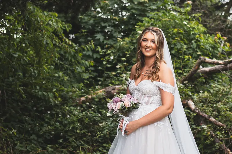 Bride holding her bouquet during natural bridal portraits at a documentary wedding in Yorkshire