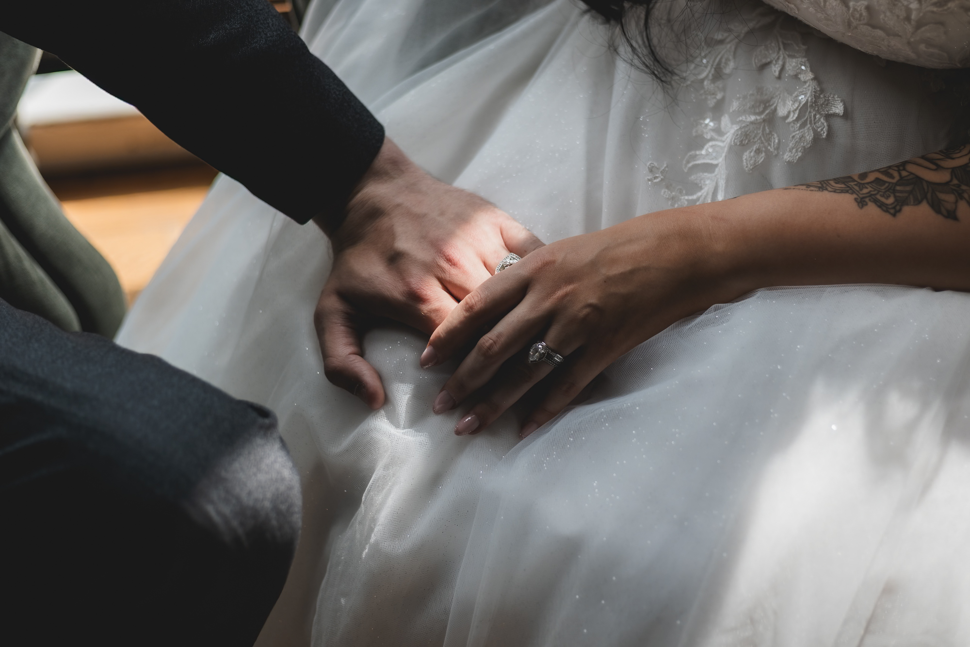 Romantic close up of bride and groom hands with wedding rings, cinematic documentary wedding photography in Yorkshire by Manos Photography